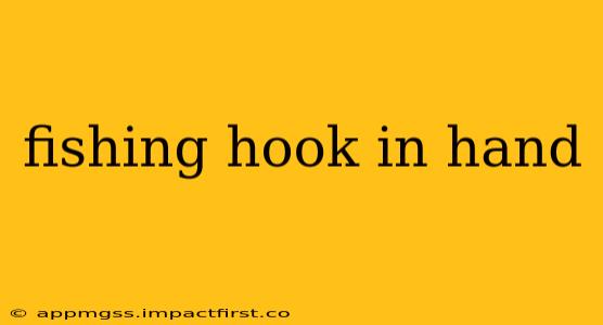 fishing hook in hand